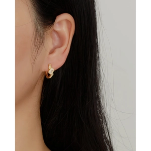 Elegant gold S925 silver hoop earrings with rectangular diamonds on a model