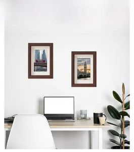 Close-up of wooden photo frames in walnut finish with classic London theme art prints
