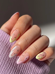 Macro shot of almond-shaped press-on nails with colorful abstract wave patterns and gold stars