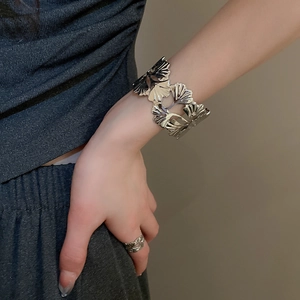 Silver ginkgo leaf open cuff bracelet and ring set showing hollow engraved vein details