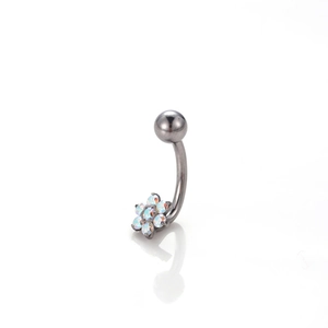 Close-up of curved barbell navel ring featuring a colorful opal flower and metal ball