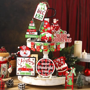 Macro detail of Christmas tiered tray decor featuring wooden gnomes and festive signs