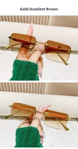 Close-up of rimless gradient brown sunglasses with gold metal wood-grain temples