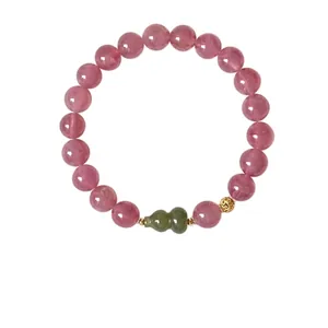 Elegant strawberry quartz beaded bracelet with green gourd pendant and golden flower bead