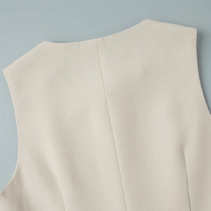 Detail of premium beige twill vest back with precise stitching and refined texture