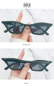 Detailed side and back view of cat eye sunglasses encrusted with black rhinestones