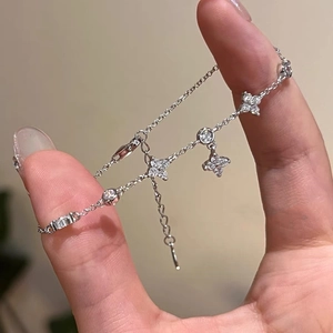 Elegant silver four-leaf clover zircon bracelet with adjustable chain for women