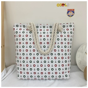 Detail of high-density canvas tote with anchor print and thick woven rope handles