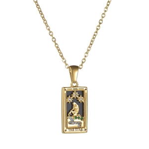 Detail shot of vintage 18k gold plated tarot necklace featuring The Star card with crystals
