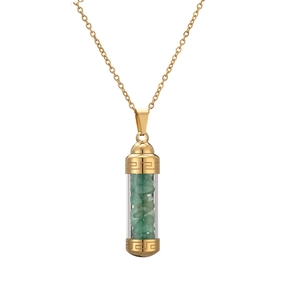 Golden stainless steel perfume bottle necklace with green crystals on white background