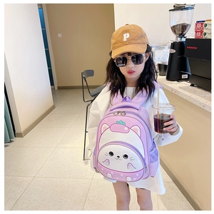 Detail of cute purple cartoon backpack with 3D animal design on child model