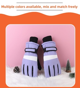 Detail of purple and white winter gloves with windproof cuff and adjustable strap