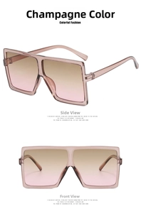 Detail view of large square champagne sunglasses with gradient lenses and thick frame