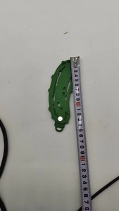 Detailed measurement of the green pickle Christmas ornament showing size near 11cm