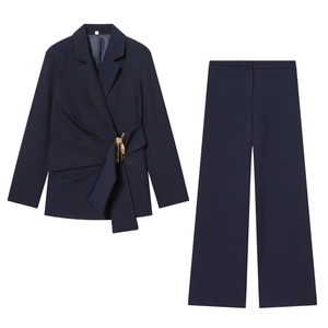 Detailed flat lay of a navy blue professional two-piece women suit with waist buckle