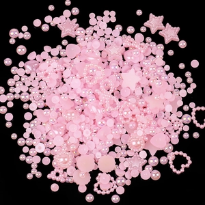 Mix of pink iridescent resin beads in heart and star shapes for DIY nail art design