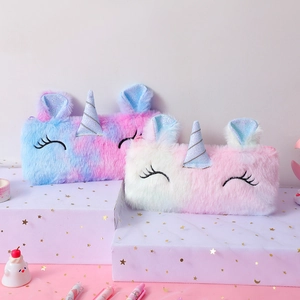 Detail of plush unicorn pencil cases showing soft faux fur and glitter horn ornaments