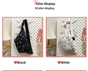 Canvas dog and cat pattern fanny packs in black and white displayed on a pegboard