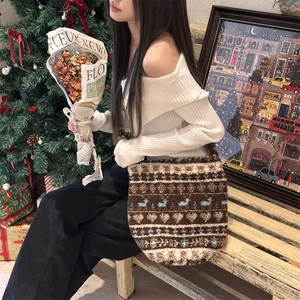 Plush brown autumn tote bag with Nordic jacquard heart patterns shown in a cozy indoor setting
