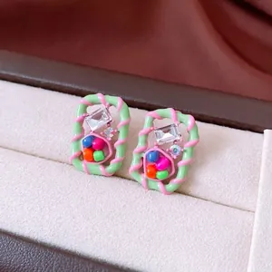 Vintage style square mosaic glass bead earrings with mint green and pink swirl enamel