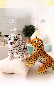 Realistic snow leopard and cheetah plush toys standing on a cozy white pillow