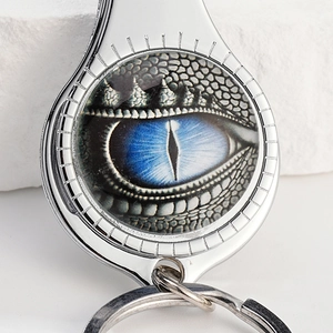 Father's Day bottle opener keychain with a blue dragon eye time gem on a stone base