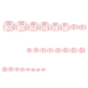 Minimalist light pink press-on toe nails with white daisy patterns and French tips