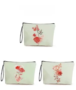 Detail display of floral cosmetic bags with rose patterns and black wrist straps