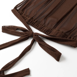Detail of dark brown knit fabric with silver glitter threads and ruched tie string