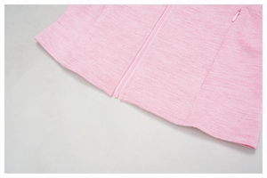 Detailed view of pink heather fabric texture with hidden side zipper pocket on fitness jacket