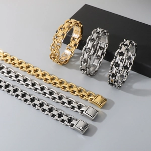 Close-up of punk style geometric steel bracelets in gold, silver and vintage silver finishes