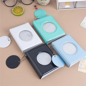 Mini photo albums in four colors with heart cutout windows and matching beaded chains