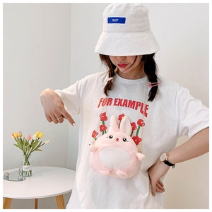 Pink plush rabbit crossbody bag for kids with gold chain strap shown on a model