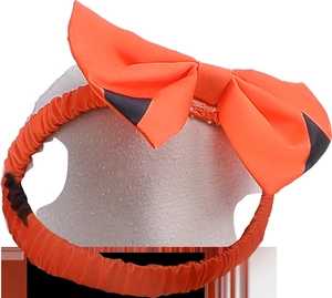 Detail of Halloween orange pumpkin bow headband with black accents for girls