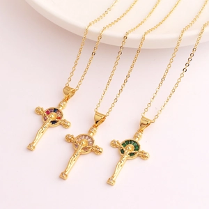 Detailed macro of 18K gold plated crucifix pendants with colorful zircon inlay