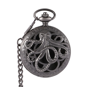 Detailed close-up of vintage hollow octopus and star patterns on a metal pocket watch cover