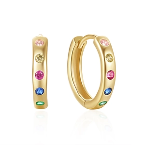 Close-up of golden S925 silver huggie earrings with colorful rainbow zircons and reflections