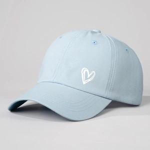 Light blue cotton baseball cap with white heart print and classic six-panel design