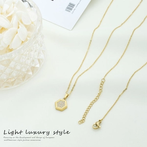 Minimalist gold titanium steel necklace with a zircon-encrusted hexagon pendant for women