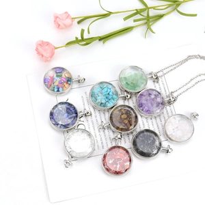 Round crystal pendant necklace filled with colorful natural gemstones on white card