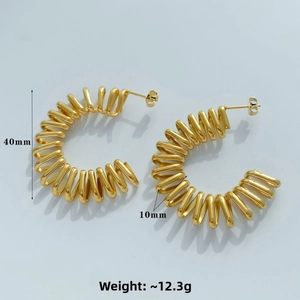 Detailed view of 40mm golden spring hoop earrings with 10mm thickness and plug closure