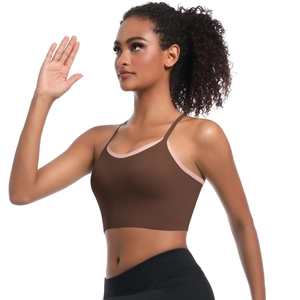 Detail of cross strap sports bra in brown and pink with high elasticity for yoga