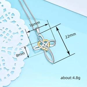 Cross necklace with gold heart pendant on silver box chain, 45-degree angled product view