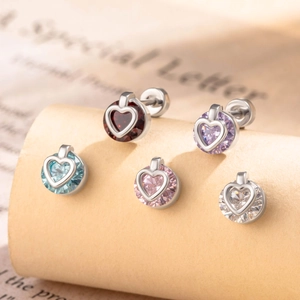 Sweet heart shaped cartilage studs with colorful zircons set in silver metal bases