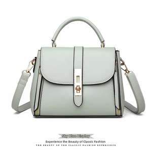 Sky blue women's square bag detail with golden metal clasp and detachable strap