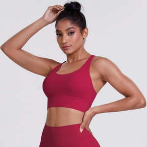 Detail of high-stretch burgundy yoga bra with wide straps and smooth brushed texture