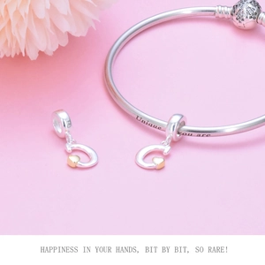 Detail of S925 sterling silver G-letter heart charm with Unique you are engraved bangle