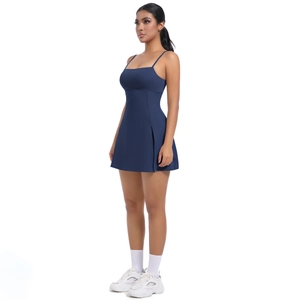 Detail of dark blue tennis dress featuring slim straps and a functional side slit hem
