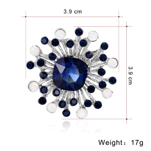 Geometric sunflower brooch with deep blue crystal and silver metal frame, 3.9 cm size
