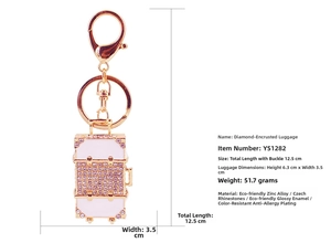 Detailed view of rhinestone suitcase keychain in rose gold with crystal dimensions